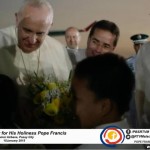 Pope Francis greets and hugs two kids who gave him flowers