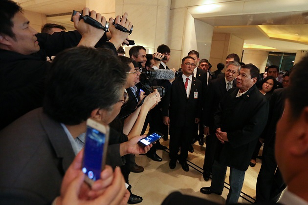 Pres. Duterte being interviewed by Beijing-based media upon arrival in China. Malacanang photo by King Rodriguez.