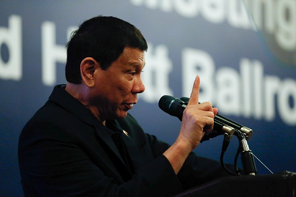 Pres. Duterte lambasts the United States in a meeting with Filipino community in China. Malacanang photo by Toto Lozano.